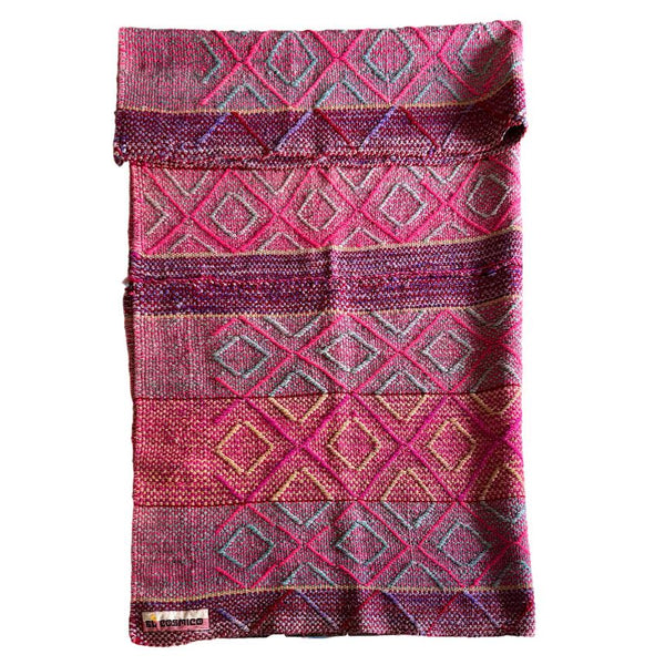Woven fabric with pink and purple geometric pattern on a white background