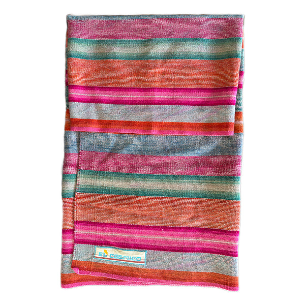 Multicolored striped towel with a brand label on a white background